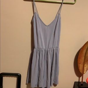 Blue romper with criss cross on back area